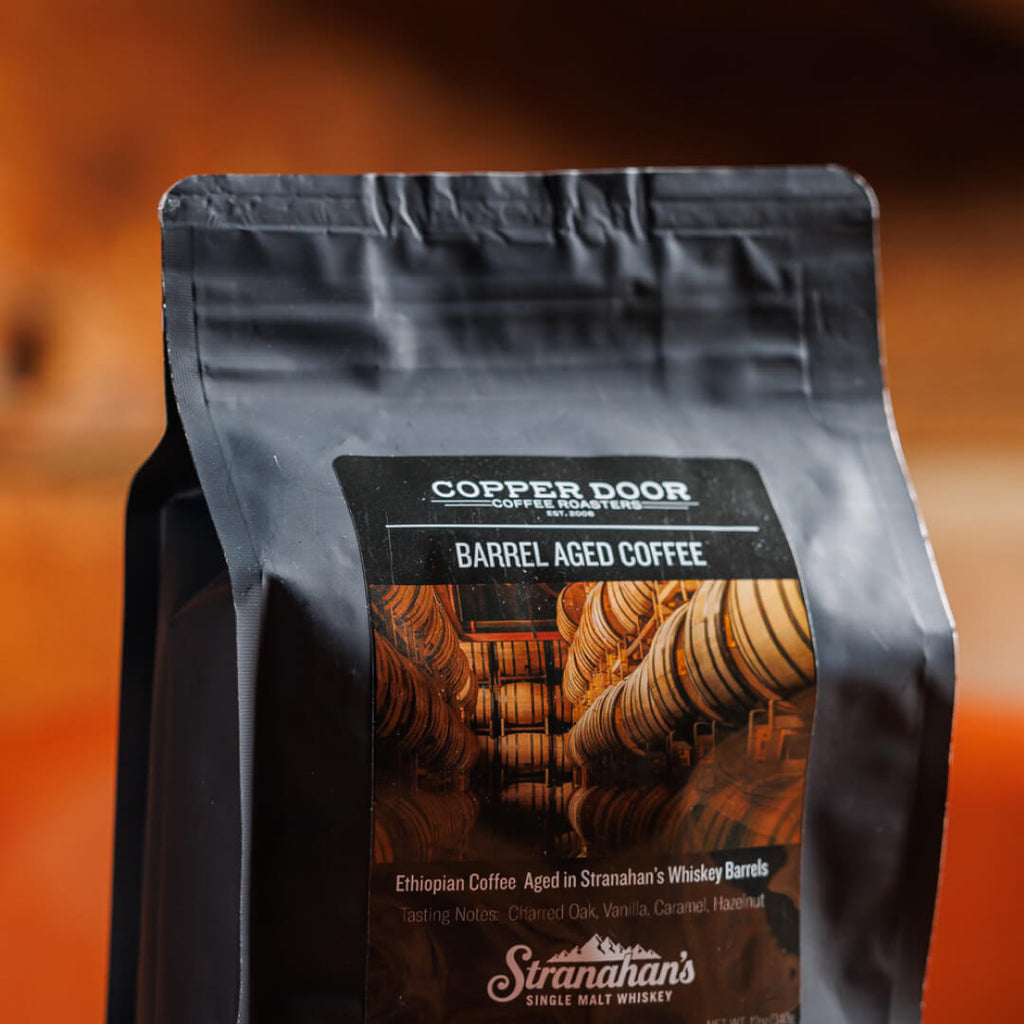 Closeup of Stranahan's Barrel aged coffee in black packaging 