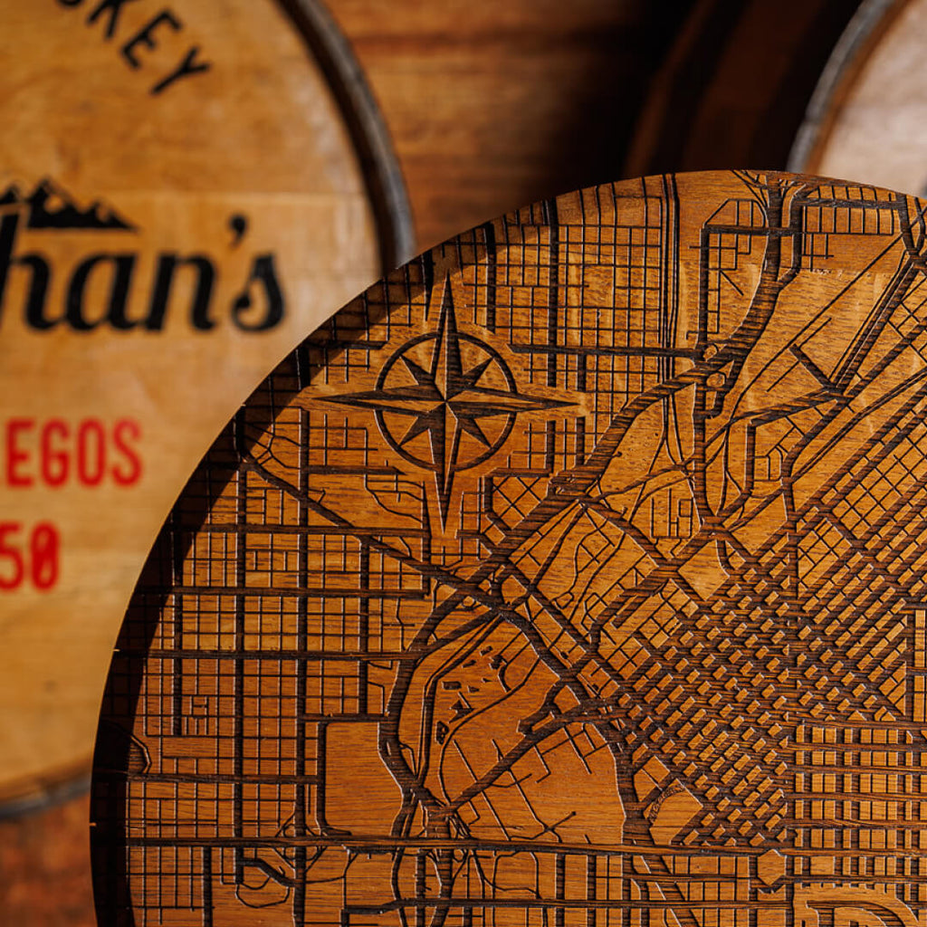 Closeup of compass detail within the map on the Stranahan's Barrel Sign