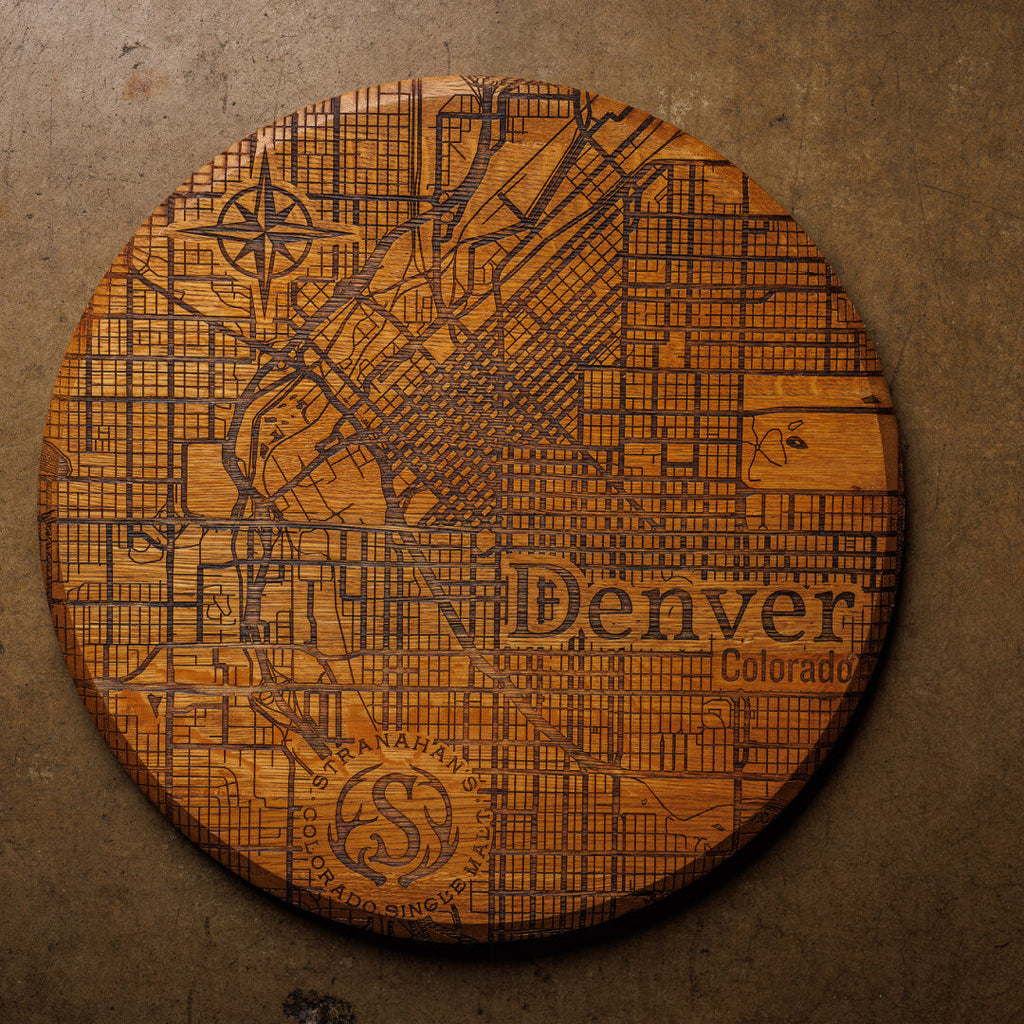Stranahan's Barrel sign etched with map of Denver, Colorado on cement surface