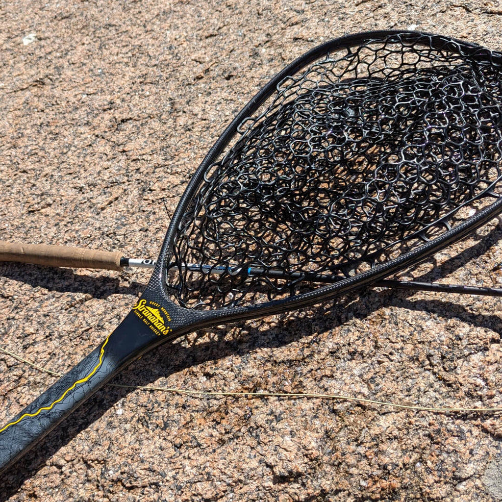 Fishpond x Stranahan's Fishing Net on rock surface