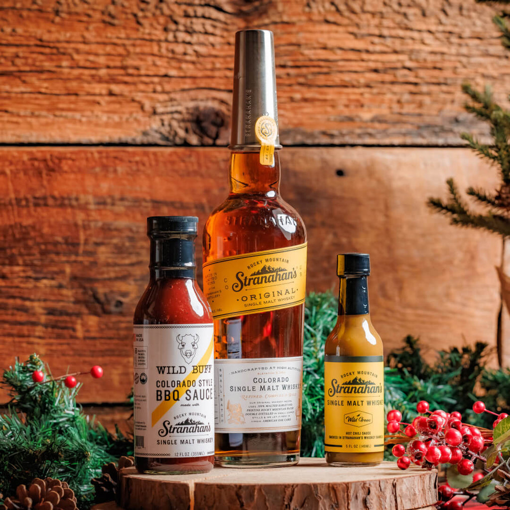 The Grillhouse Trio: includes Whiskey-Infused BBQ Sauce from Wild Buff, Barrel-Smoked Hot Chili Sauce from Wild Green, and Stranahan’s Original Whiskey.