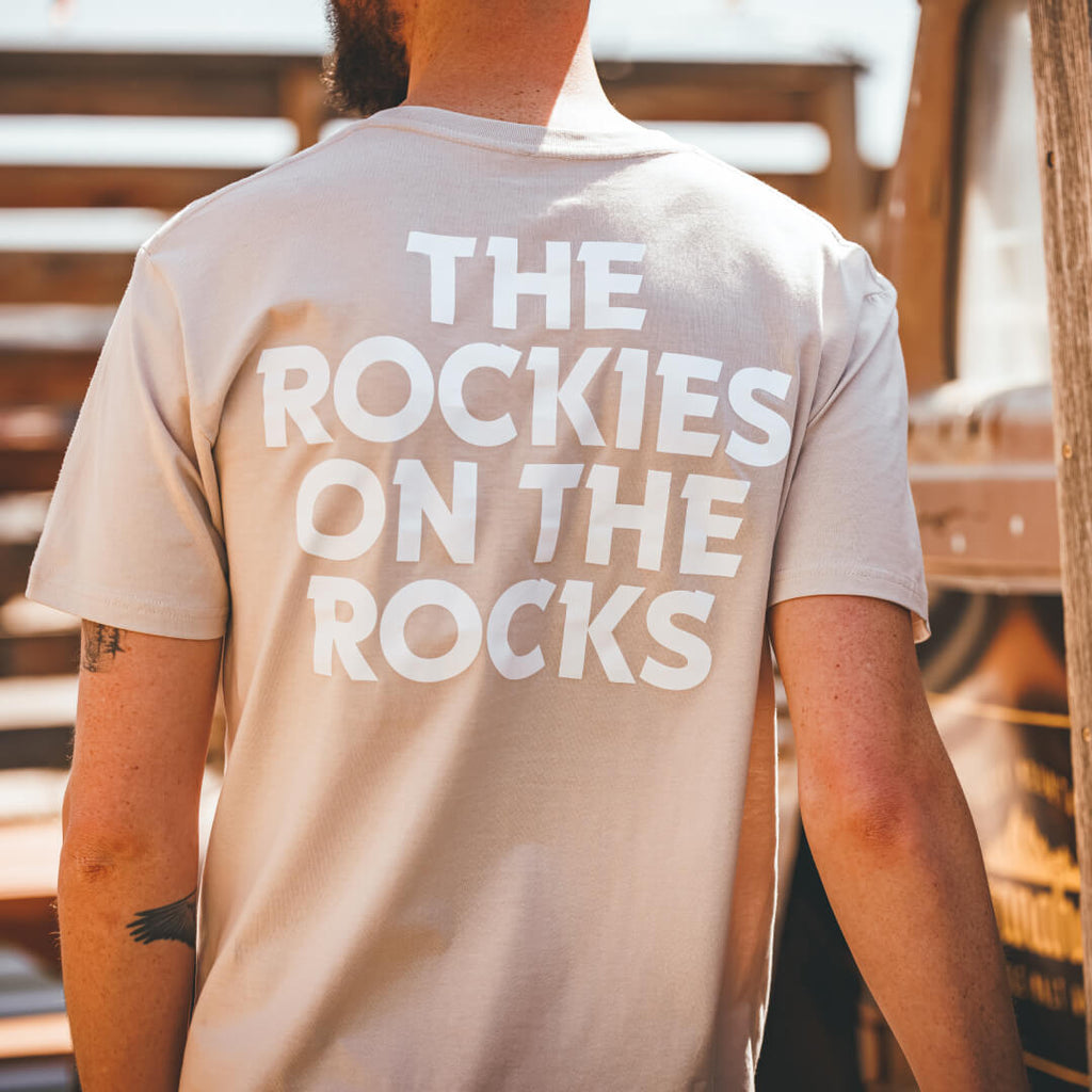 Rear view of Stranahan's Rockies On The Rocks tee slogan