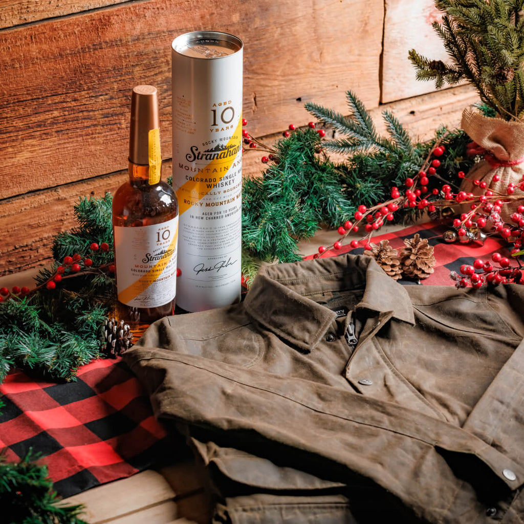 Whiskey Weather Bundles includes: Stranahan’s Mountain Angel, 10 Year with the Huckberry x Stranahan’s Waxed Trucker Jacket.