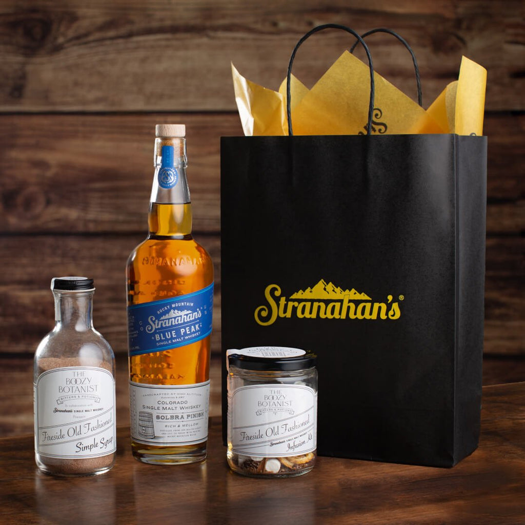 Stranahan's Fireside Cocktail Bundle on rustic surface