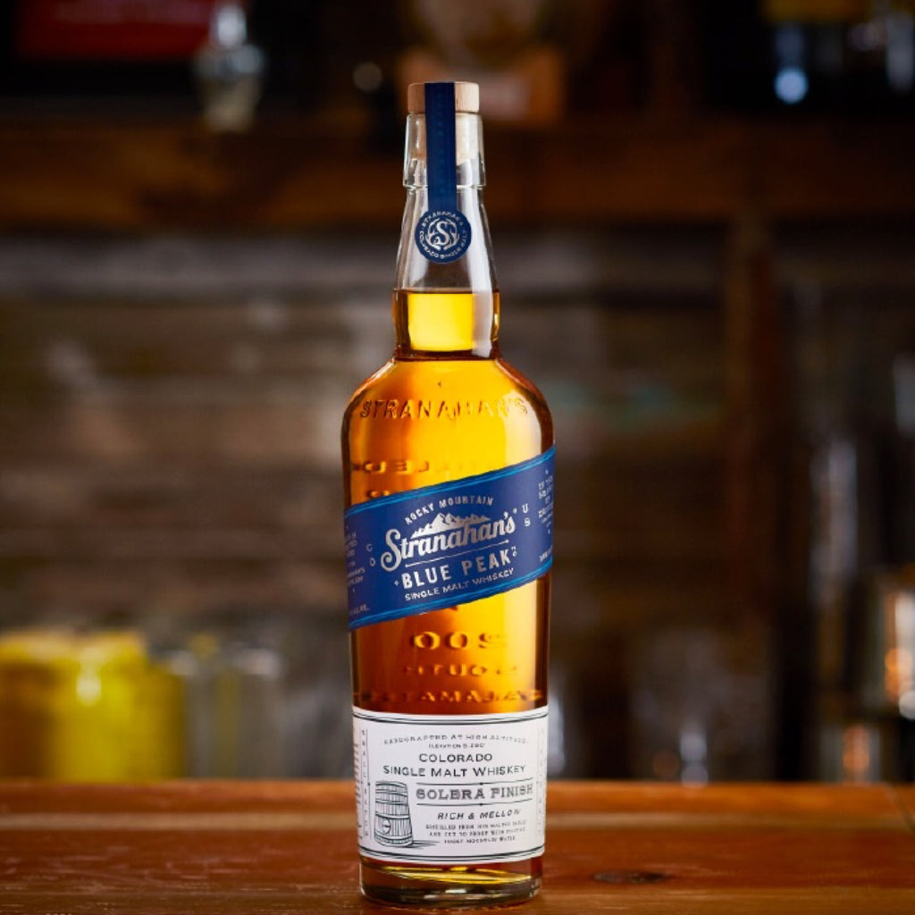 Bottle of Stranahan's Blue Peak Single Malt Whiskey placed on a bar.