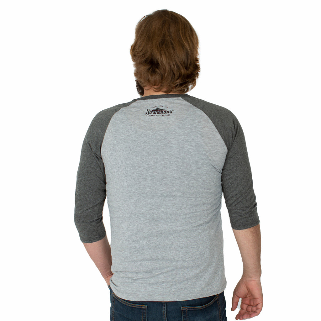 Back view of male model wearing a grey Stranahan's baseball tee.