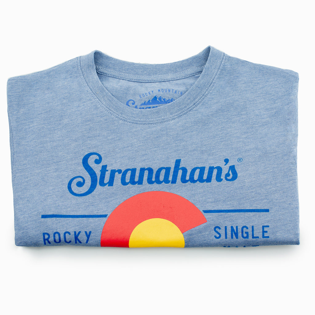 Stranahan's Colorado state flag tee folded on a white background.