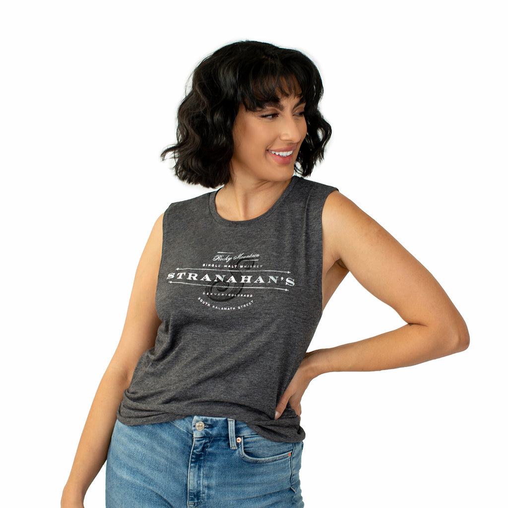 Front view of female model in grey Stranahan's muscle tank.