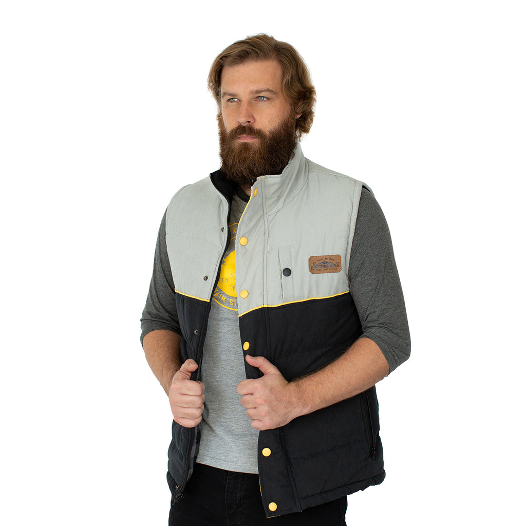 Front view of unbuttoned Stranahan's puffer vest on male model.