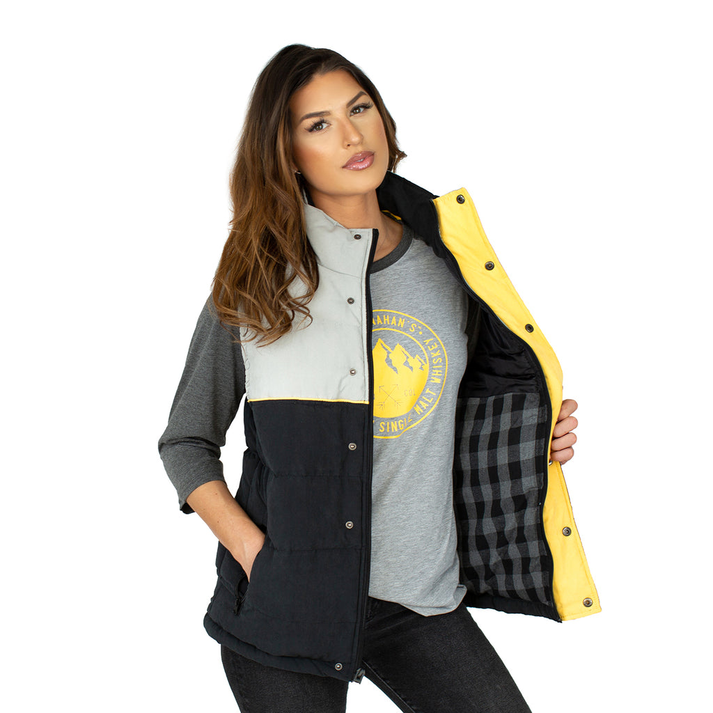 Front view of buttoned Stranahan's puffer vest on female model.
