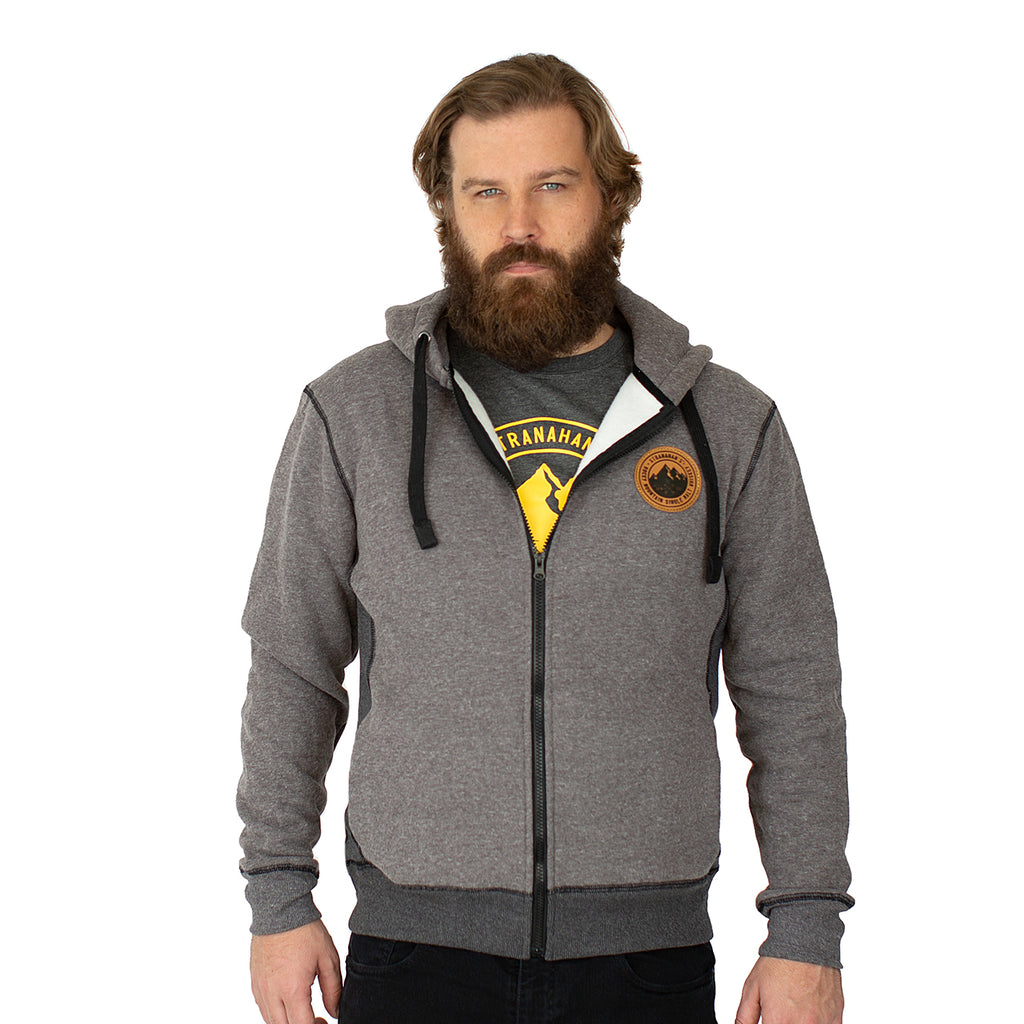 Front view of Stranahan's grey zip hoodie on male model.