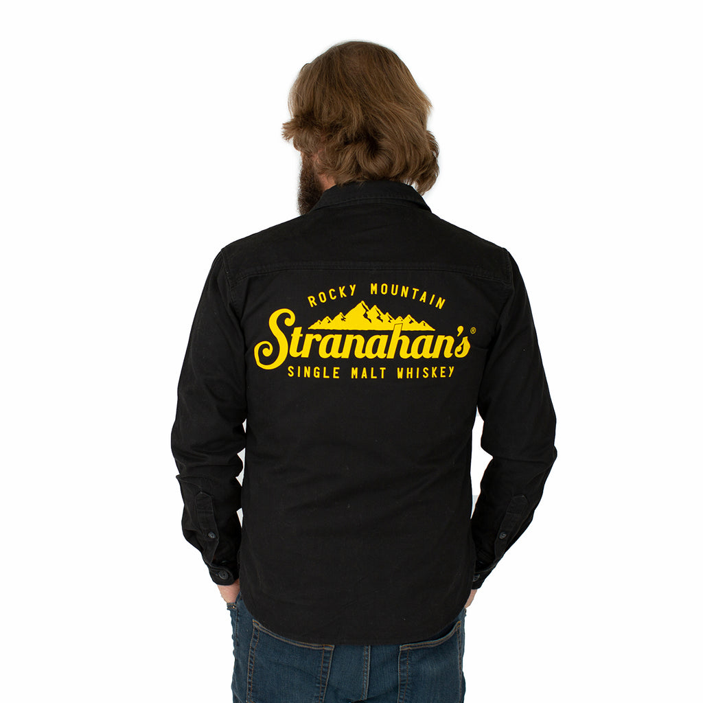 Back view of Stranahan's black work shirt on male model.